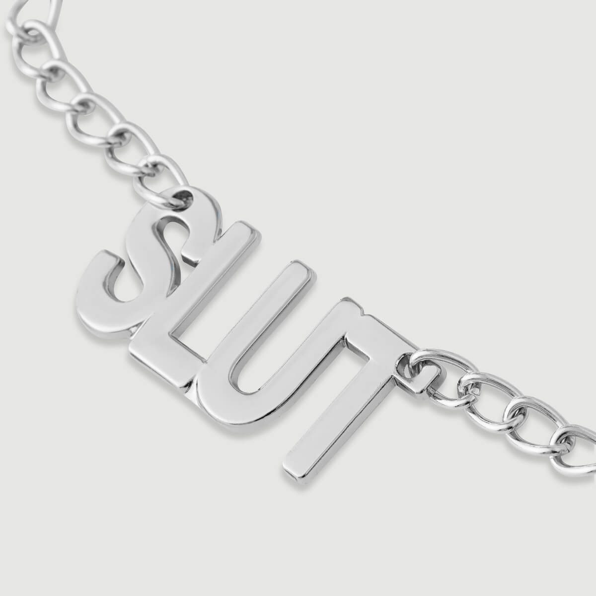 Nipple Clamps With Chain & SLUT Tag – Silver by Sexopolis