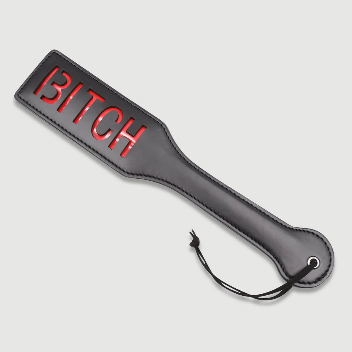 Δερμάτινο Paddle Με Χάραξη BITCH Domme Series Leather Paddle With BITCH Cutout – Μαύρο by Sexopolis